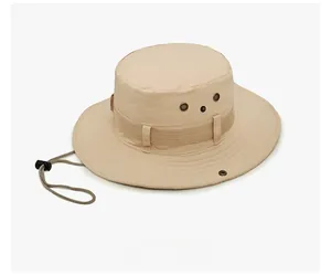 Side view of beige outdoor wide brim sun hat with ventilation holes and windproof cord