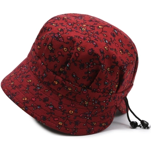 Detail of red floral sun hat fabric showing stitching and adjustable drawstring