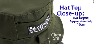 Detailed close-up of an olive green cotton bucket hat with a 10cm crown depth and side label
