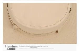Detailed macro view of breathable mesh fabric and reinforced stitching on beige sun hat