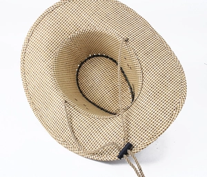 Detail view of woven paper straw cowboy hat with adjustable black chin strap for sun protection