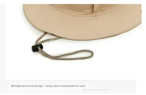 Adjustable windproof rope detail on beige outdoor sun hat with black toggle fastener