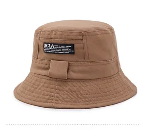 Detail of the stitching on a khaki canvas bucket hat featuring a UCLA textile label