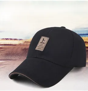 Close-up of black cotton baseball cap featuring a brown leather patch and extended brim