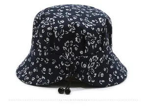 Detail of the rear adjustable drawstring and floral pattern on the navy blue sun hat