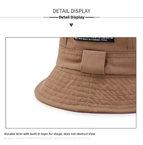 Detail view of khaki cotton bucket hat brim with sturdy internal layer for shape retention