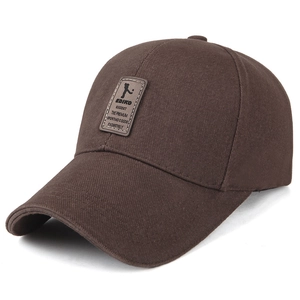 Dark brown cotton baseball cap with long visor and leather EDIKO patch on white background
