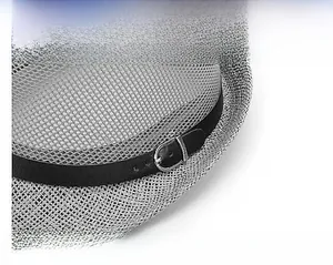 Detail view of woven straw fedora with black faux leather band and silver metal buckle