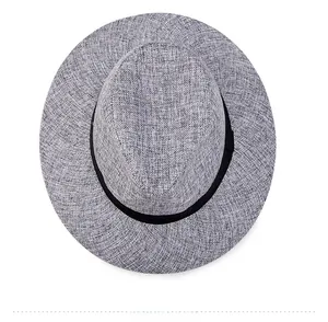 Top down view of a breathable off-white woven fedora hat with a black ribbon band