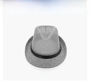 Macro view of breathable grey mesh texture and black decorative ribbon on summer fedora hat