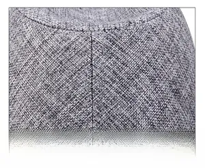Macro shot of precise stitching on textured linen blend brim of a casual men's hat