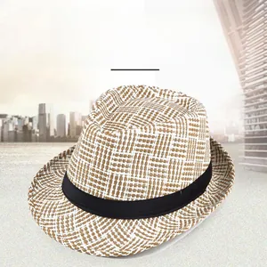 Detail of summer straw fedora hat featuring woven plaid texture and black decorative ribbon