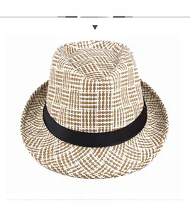Detailed view of summer straw fedora with brown check pattern and black ribbon band