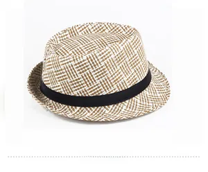 Detail view of the classic woven lattice pattern and black band on the summer straw hat