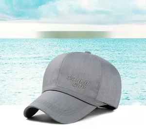 Detailed view of grey baseball cap featuring 3D SD.H.G letter embroidery on polyester fabric