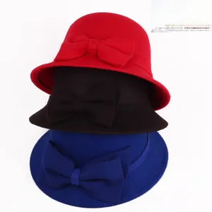 Three colors of wool cloche hats with bows including red, black and royal blue