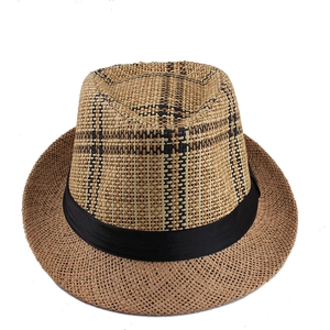 Close-up of summer straw fedora hat featuring a plaid pattern crown and black satin ribbon