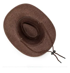 Detail view of the brown wide-brim linen hat interior with adjustable woven chin strap