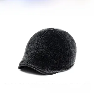 Detail of black winter baseball cap with faux fur texture and top button detail
