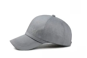 Detailed side view of grey baseball cap featuring premium SD.H.G CAP embroidery
