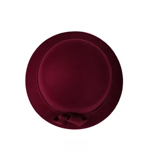 Top view of a burgundy wool felt cloche hat featuring a decorative ribbon bow