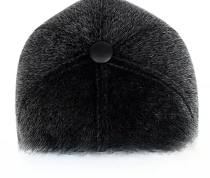 Macro view of six-panel crown with top button on plush faux mink baseball cap