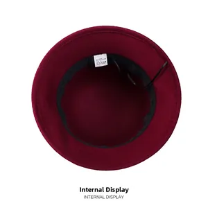 Interior view of wool blend cloche hat showing sweatband, size 57, and 50% wool label