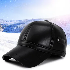 Close-up of black leather winter baseball cap with ear flaps for men over snow background