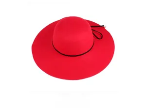 Detail view of red wide brim felt hat with black ribbon and small pearl decoration