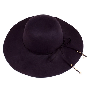 Detail of black wide brim wool hat featuring bow with pearls and gold beads