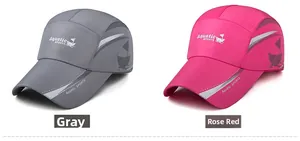 Detail of quick-dry baseball caps in grey and rose red with reflective strips