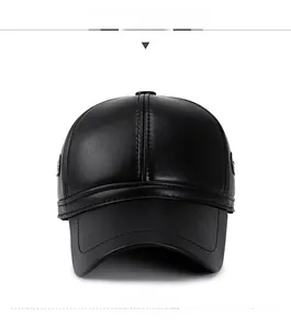 Detailed view of black faux leather baseball cap with pebble grain and reinforced seams
