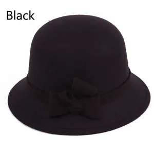 Elegant black wool cloche hat for women with a classic ribbon bow on white background