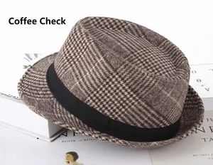 Detail of coffee plaid herringbone fedora hat with black grosgrain ribbon and classic texture