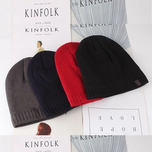 Detailed close-up of ribbed knit beanie cuff in four colors on a fashion magazine
