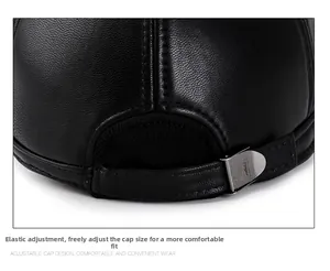 Close-up of adjustable metal buckle and elastic band on black leather men's cap