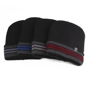 Detail of winter knit beanies in four colors with double stripe design and sports label