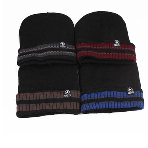 Detailed view of knitted winter beanies with striped cuffs and sports star woven labels