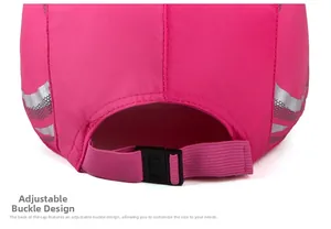Detail of rose pink cap with adjustable elastic strap and black plastic buckle