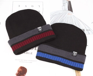 Detail of knitted winter beanie featuring striped patterns and star emblem patch