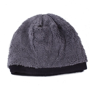 Detail view of the thick grey plush lining and black knitted edge of this winter beanie