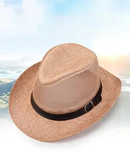 Close-up of a woven straw jazz hat with a black leather band and metal buckle detail