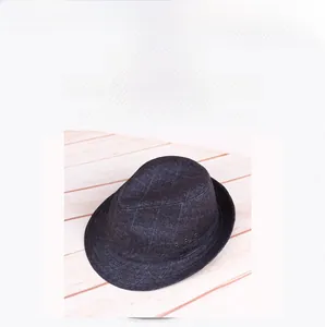 Detail of dark grey grid pattern fedora hat featuring three metal ventilation eyelets