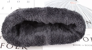 Detail of dark grey thick fleece lining for winter beanie hat showing soft texture