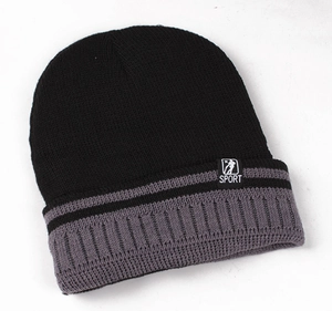 Detail of winter knit beanie showing SPORT label and black-grey ribbed cuff texture