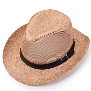 Macro detail of breathable mesh crown and brown straw texture on outdoor summer sun hat