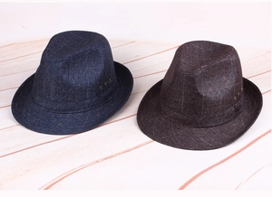 Detail of retro fedora hats with metal eyelets and textured fabric in navy and brown