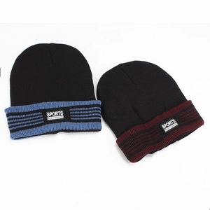 Close-up of knit texture and sports fashion label on thick winter beanies