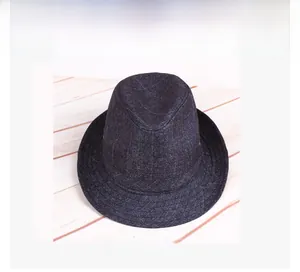 Detail of navy blue fedora hat with quilted texture and classic indented crown for men