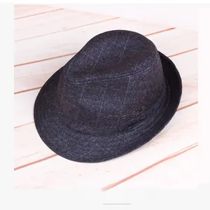 Detail view of dark grey fedora hat with plaid texture and metal side eyelets